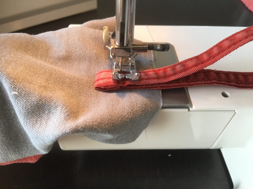 sew a loop on the repurposed draft stopper